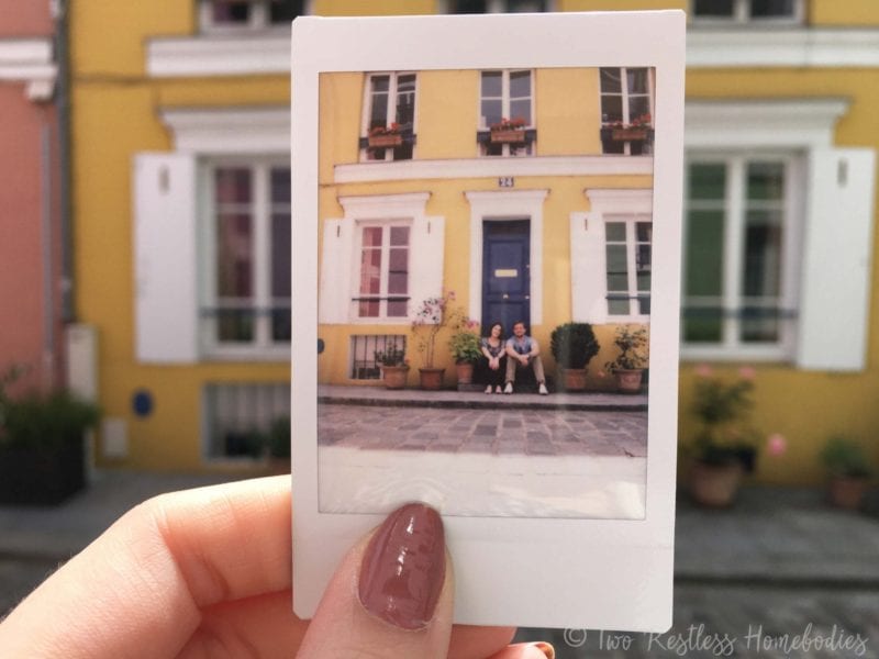 Meagan and Luke sitting on Rue Cremieux in Paris
