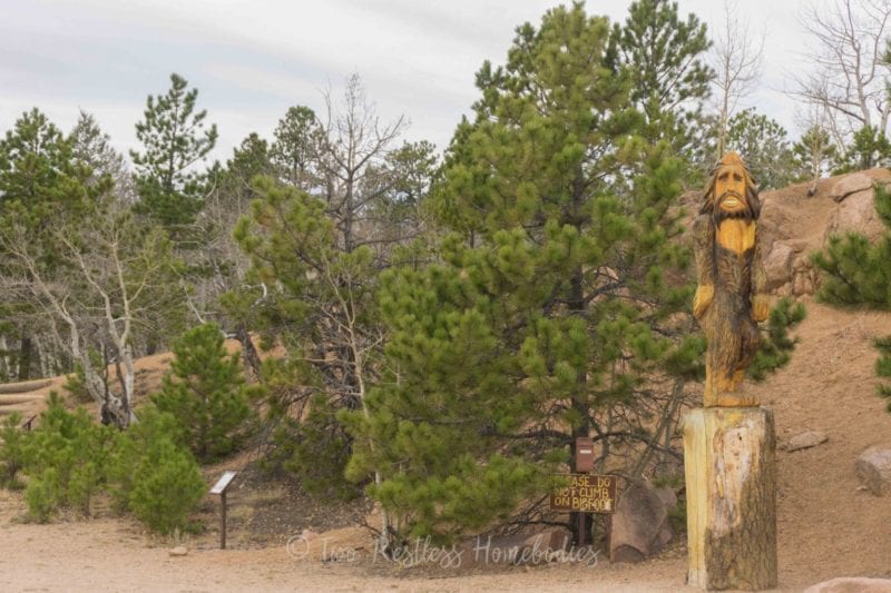 Crystal Creek Reservoir Bigfoot wood statue, Pikes Peak, Colorado Springs CO USA