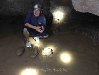 Cave tubing guide showing Mayan relics