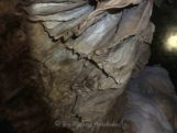 Stalactite curtains fallen from ceiling of Footprint Cave